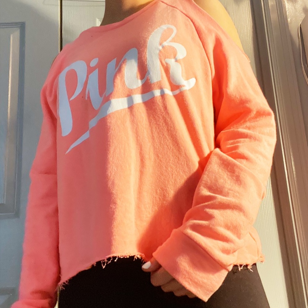 Pink sweatshirt with shoulder holes